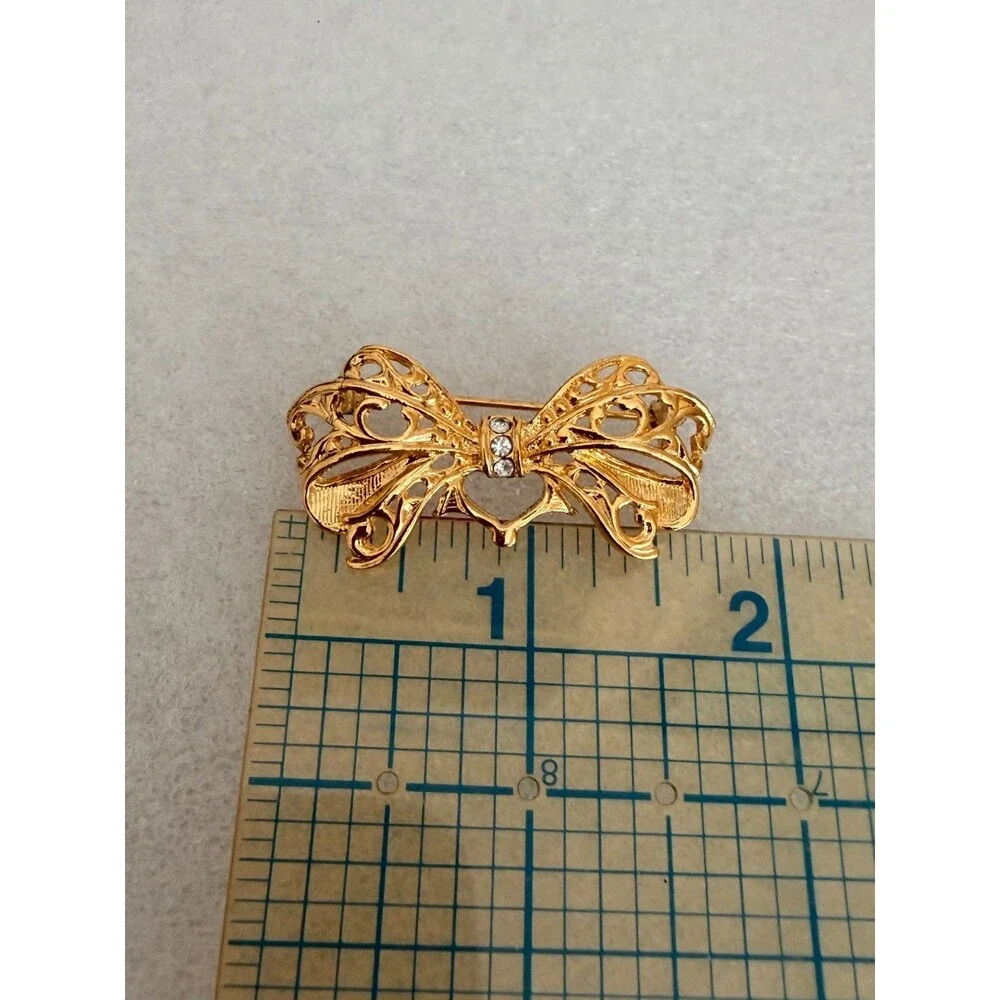 Vintage Gold Tone Openwork Filigree Bow Brooch Rhinestone Accent Pin